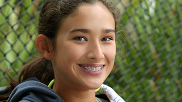 Smiling teen girl with braces in Webster