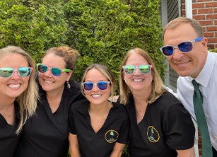 Rochester orthodontist and team members smiling outdoors with sunglasses