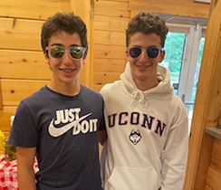 Two young boys smiling in orthodontic office in Webster