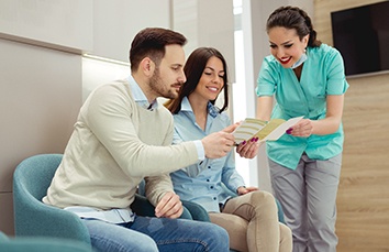 dental professional explaining benefits to patients