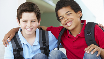 Two young boys smiling together