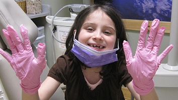 Smiling young girl in orthodontic office