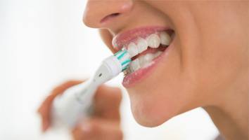 Woman brushing her teeth