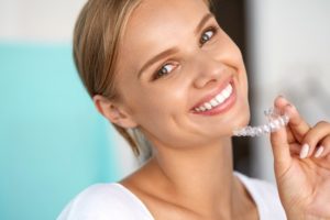 Woman smiling with Invisalign