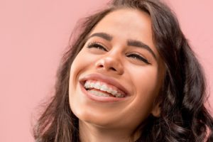 Woman with braces smiling.